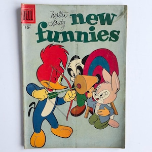 Puede incluir: Portada de cómic vintage de Dell con Woody Woodpecker apuntando con un arco y una flecha. La portada dice "new funnies" y "Walter Lantz". El cómic está fechado en octubre y cuesta 10¢. Presenta personajes de dibujos animados.