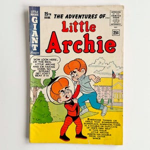 May include: A vintage comic book titled "Little Archie" with a vibrant cover. The cover features two Archie characters, one in a space suit. Text includes "25th Issue" and "The Adventures of..." The comic is in good condition.