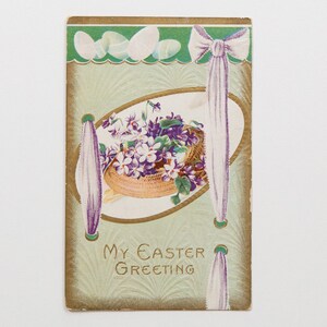 SPEDIZIONE GRATUITA: Autentica cartolina d'epoca antica di Pasqua del 1911 - Cartolina con violette primaverili in un cestino - "Il mio saluto di Pasqua"