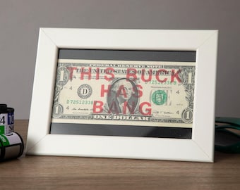 Framed Money Art - Dollar Artwork in White Frame - This Buck Has Bang