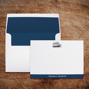 May include: A white card with a blue border and a black and white illustration of a sailing ship. The text "Thurston J. Howell III" is printed on the blue border.