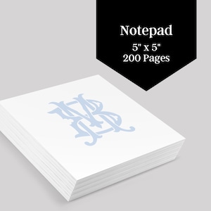 May include: A stack of white notepad paper with a light blue monogram of the letters "MB" in a decorative font. The notepad is 5 inches by 5 inches and has 200 pages. Notepad.