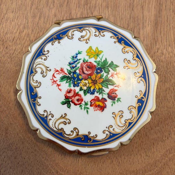 Unique Vintage Stratton England makeup pink floral Rose Compact . The Queen. 1970. White background with blue and gold edging