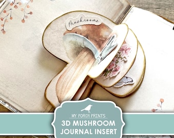 May include: Printable 3D mushroom journal insert with the text "My Porch Prints 3D Mushroom Journal Insert Printable" on a blue banner. The mushroom is made of paper and has a watercolor design. The background is a vintage book with floral designs.