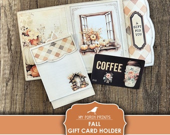 Può includere: Porta biglietti regalo stampabile a tema autunnale con una scena di finestra, zucche e una tazza di caffè. Il porta biglietti è progettato per essere piegato e ha una fessura per un biglietto regalo. Il testo "Un regalo per te" e "Caffè" è visibile sul porta biglietti.