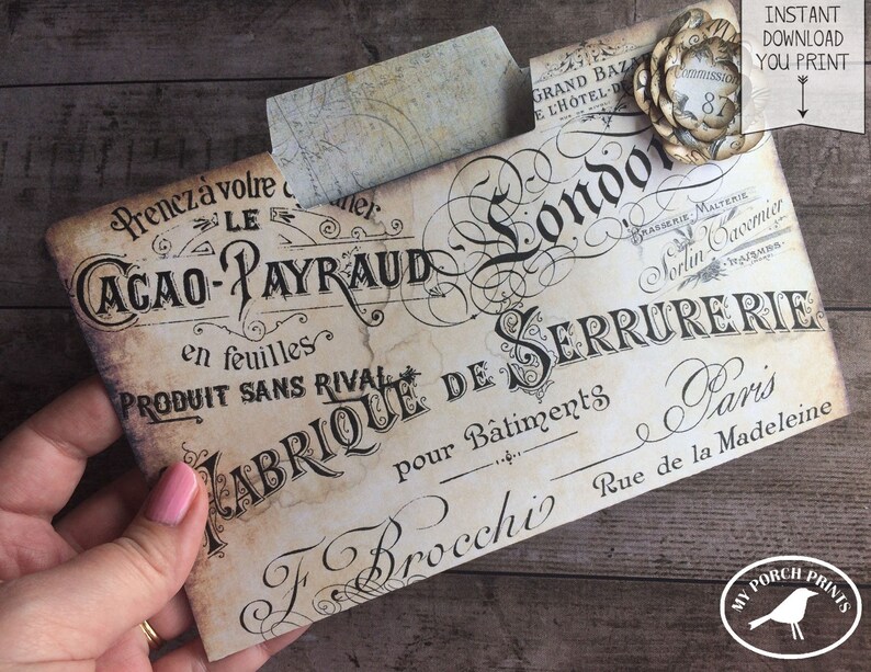 May include: Vintage-style printable envelope with the text "Cacao-Payraud en feuilles Produit Sans Rival Fabrique de Serrurerie pour Batiments F Brocchi Rue de la Madeleine Paris" in black script on a cream background.