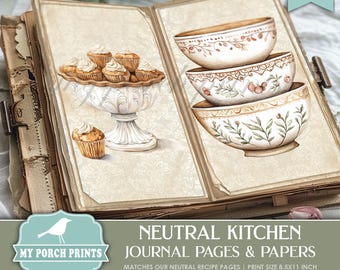 May include: Two printable journal pages featuring a neutral color palette. The left page shows a white pedestal bowl filled with cupcakes. The right page shows three stacked bowls with a floral design. The text "NEUTRAL KITCHEN JOURNAL PAGES & PAPERS" is at the bottom of the image.