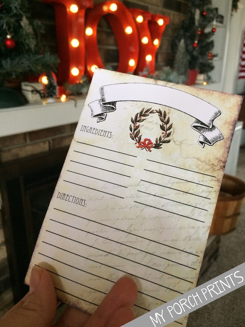May include: A printable recipe card with a vintage design. The card has a banner with a wreath and the words "Ingredients" and "Directions" printed on it.