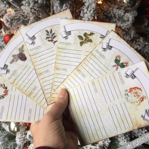 May include: Set of six vintage-style recipe cards with a Christmas theme. Each card features a different festive illustration and has lines for writing ingredients and directions. The cards are printed on aged paper with a distressed look.