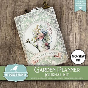 May include: A garden planner journal kit with a floral watering can design. The journal is held by a gold clip and features tabs for garden, seasonal, shopping, and to-do lists. The assembled size is approximately 4.25 x 6.5 inches.