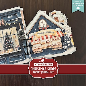 Puede incluir: Un kit de diario de bolsillo con temática navideña que presenta una ilustración de una tienda azul con una pancarta de "Merry Christmas". El diario incluye una fachada de tienda con productos horneados y un árbol de Navidad. El kit es una descarga digital.
