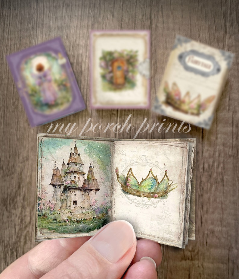 May include: A small, open book with a watercolor illustration of a fairytale castle on the left page and a green fairy crown on the right page. The book is open to show the pages and is being held by a hand.