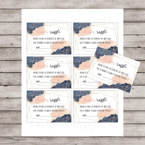 May include: A set of six printable diaper raffle tickets with a watercolor background in shades of pink and blue. The text on the tickets reads "diaper raffle" and "Bring a pack of diapers of any size for a chance to win a special prize!"