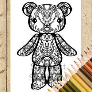 May include: A black and white line art coloring page featuring a teddy bear with intricate floral patterns. The bear is standing with its arms outstretched.