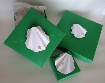 Origami Gift Boxes each topped with Origami White Clam Shell topped with a Pearl (minimum order three boxes)