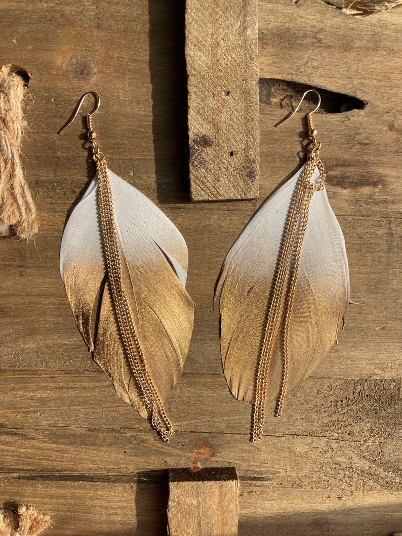 Gold dipped feather earrings Outlet
