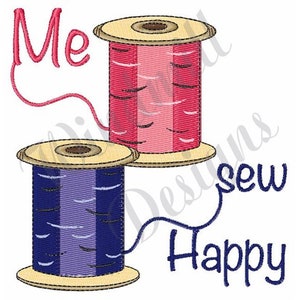 May include: Two spools of thread, one pink and one purple, with the words "Me sew happy" in blue embroidery.