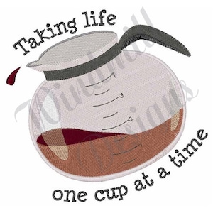 May include: A white glass coffee pot with brown coffee inside. The pot has a black handle and spout. The text "Taking life one cup at a time" is written below the pot.