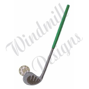 May include: A green and silver golf club with a white golf ball.