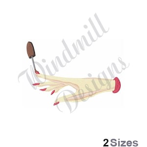 May include: A hand with red nail polish is holding a nail polish brush. The hand is wearing a red bracelet.