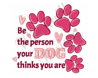 May include: Pink paw prints and hearts surround the text "Be the person your DOG thinks you are".