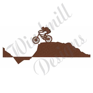 May include: Silhouette of a person riding a mountain bike over a brown dirt hill.