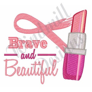 Pode incluir: Fita rosa com o texto "Brave and Beautiful" e um batom rosa e prateado.