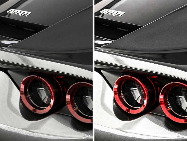 May include: Close-up of the rear end of a black car with red taillights. The car has a silver trim around the taillights and a silver trim around the rear window. The car has a Ferrari logo on the back.