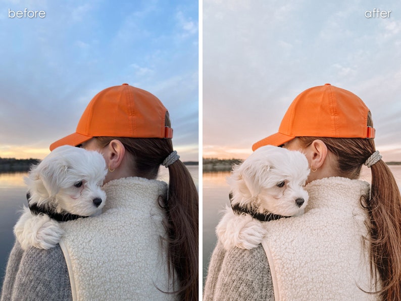 Op de afbeelding: Een vrouw met een oranje baseballpet houdt een witte, pluche hond op haar schouder. De hond kijkt naar de camera. De achtergrond is een wazig beeld van een meer en de lucht.