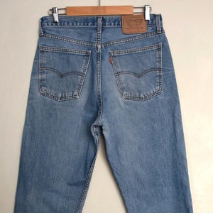 Distressed 1990&#39;s medium blue Levi&#39;s 615 jeans, Zipper Fly blue Jeans, high waist hipster jeans, 31 inch waist, 1990s pants