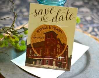 May include: A save the date card with a cork coaster featuring a church illustration. The card has the words "save the date" in elegant script. The coaster has the names "Sophia & Tommy" and the date "06.27.20".