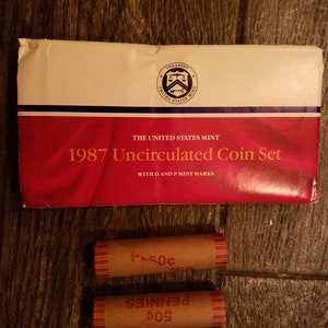 1987 Uncirculated Mint Set and 2 Rolls of American Wheat Pennies.