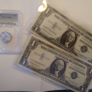 2 Silver Certificates and Jefferson Nickle housed in a PCGS Coin Holder