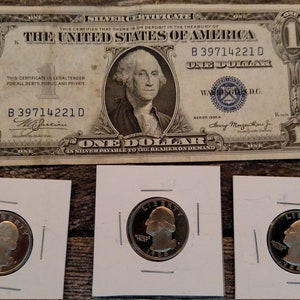 1957 Silver Certificate along with 3 carded Proof Washington Quarters