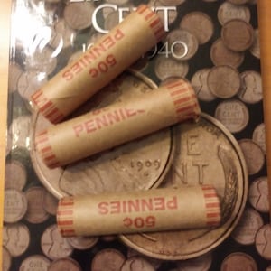 3 Rolls of Wheat Pennies that have 1 1909 VDB on Each End.  Along with a New Wheat Penny coin album to house your coins.