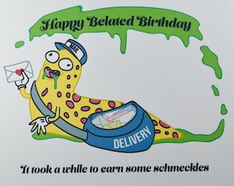 May include: A greeting card with a cartoon illustration of a yellow and pink spotted worm wearing a mailman hat and carrying a blue bag that says "DELIVERY". The worm is delivering a letter with a red heart on it. The card says "Happy Belated Birthday" and "It took a while to earn some schmeckles".