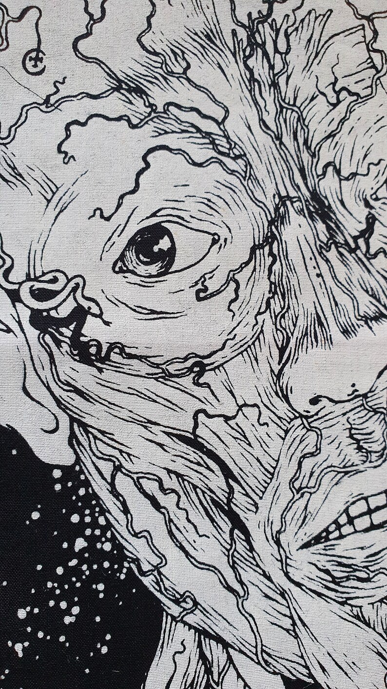 May include: Black and white illustration of a face with a detailed, intricate design. The face has a large eye and a mouth with teeth. The background is black with white dots.