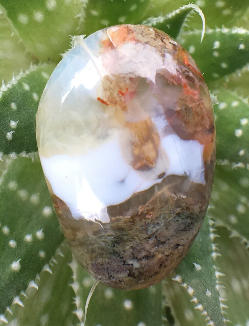 Egg shaped plume agate with green purple under water seascape moss agate thunder egg