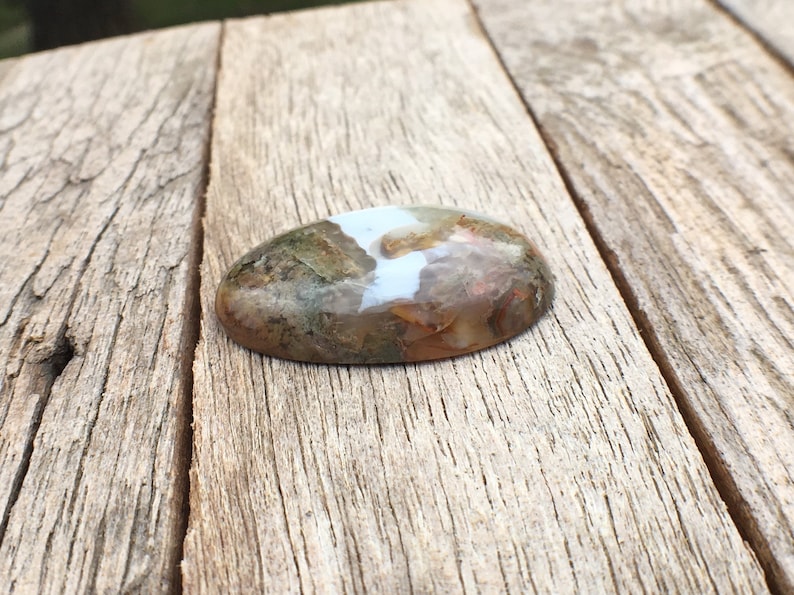 Egg shaped plume agate with green purple under water seascape moss agate thunder egg
