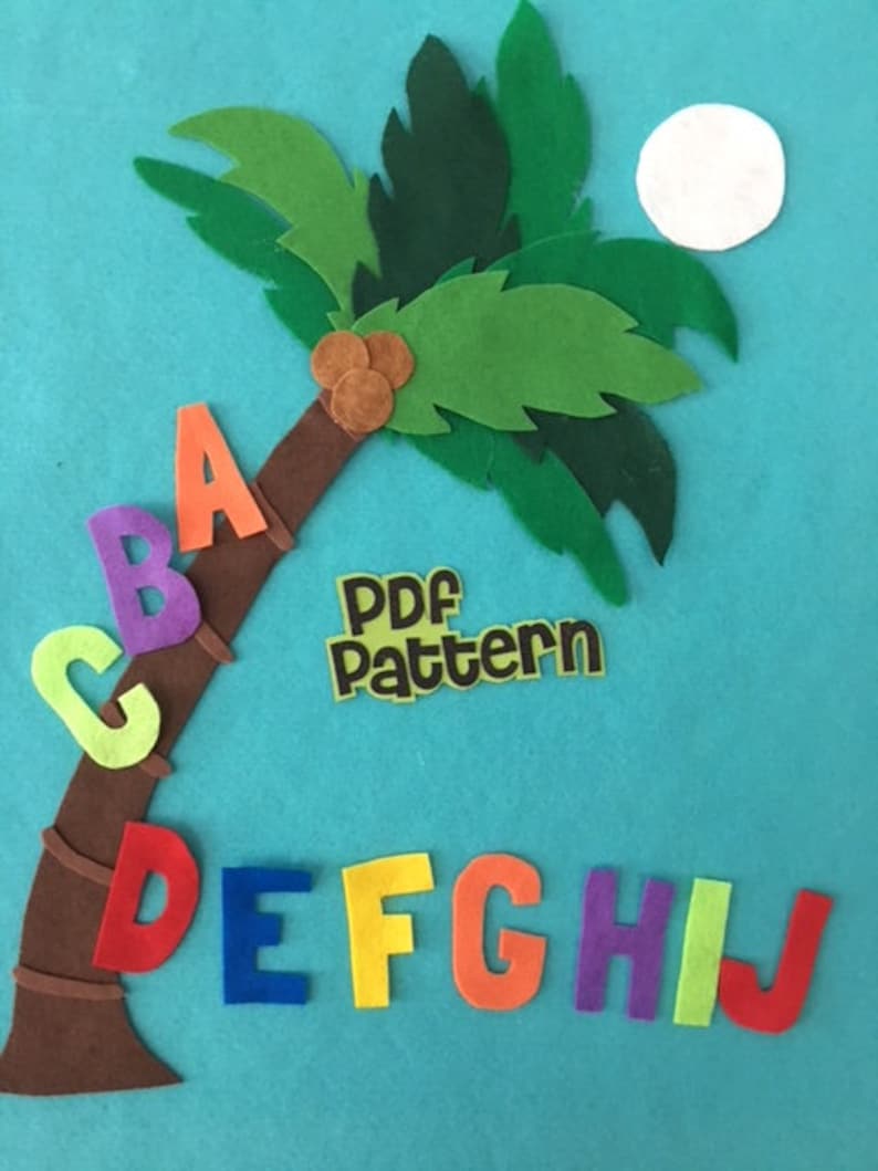 May include: Felt alphabet letters A through J arranged around a brown felt palm tree with green leaves and a white felt moon. The letters are in different colors and the text "PDF pattern" is on a yellow felt rectangle.