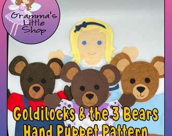 May include: Felt hand puppet pattern for Goldilocks and the Three Bears. The pattern includes a girl with blonde hair and a blue dress, and three bears with brown fur. The pattern is printed on white paper.