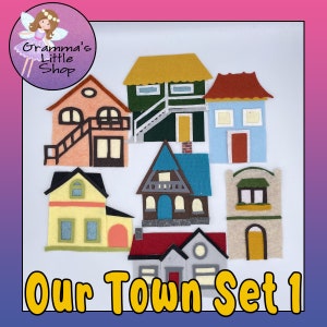 May include: A collection of colorful felt houses in various designs, including a house with a staircase, a house with a teal roof, and a house with a red roof. The text "Our Town Set 1" is displayed in yellow. The image also includes a logo for "Gramma's Little Shop."