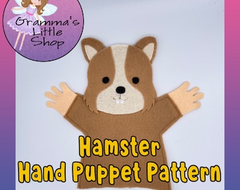 May include: A brown felt hamster hand puppet pattern with a white face and black eyes. The pattern is for a hand puppet with two arms and a head. The text "Hamster Hand Puppet Pattern" is written in yellow letters below the puppet.