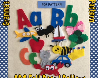 Puede incluir: Un patrón de tablero de fieltro para un tablero de fieltro ABC. El patrón incluye las letras A, B y C, así como una variedad de otras formas de fieltro, incluyendo una manzana, una abeja, un barco, un coche, un gato, un cangrejo, una corona, un avión, un lazo y brócoli. El patrón se titula "ABC Felt Board Pattern" y está disponible para descargar en PDF.