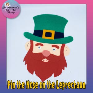 May include: A felt leprechaun face with a green hat, red beard, and a pink nose. The text "Pin the Nose on the Leprechaun" is at the bottom. The image is on a white background with a pink and purple border.