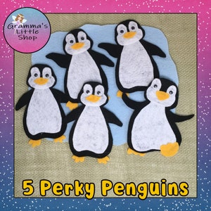 May include: Five felt penguin figures with black wings, white bellies, and yellow beaks and feet are arranged on a light blue felt background. The text "5 Perky Penguins" is displayed in yellow block letters. The image has a pink and blue gradient background.