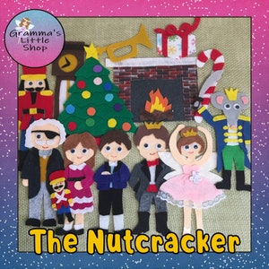 May include: Felt puppet set featuring characters from The Nutcracker, including a Nutcracker soldier, a mouse king, a ballerina, and a prince. The set also includes a Christmas tree, a fireplace, and a candy cane.