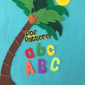 May include: A felt craft of a palm tree with coconuts, a yellow sun, and the letters "abc ABC" in different colors. The text "PDF Pattern" is on the tree trunk.