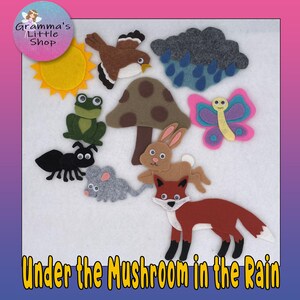 May include: A collection of felt cutouts featuring a brown bird, a gray rain cloud with blue raindrops, a yellow sun, a green frog, a brown mushroom, a pink and purple butterfly, a black ant, a gray mouse, a brown rabbit, and a red fox with white accents.