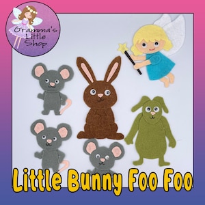 May include: Felt craft set featuring a brown bunny, three gray mice, a green dog, and a blue fairy with a wand. The set is titled "Little Bunny Foo Foo".